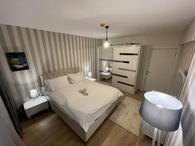 a small bedroom with a bed and a sink at King Suite SS0 in Istanbul