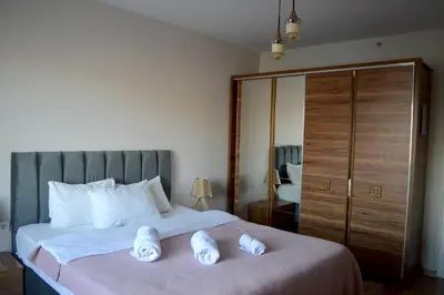 a bedroom with a bed with two towels on it at King Suite SS18 in Istanbul