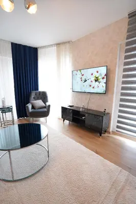 a living room with a flat screen tv on a wall at King Suite AN9 in Istanbul