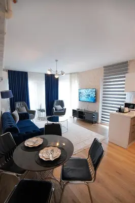 a living room with a table and chairs at King Suite AN9 in Istanbul