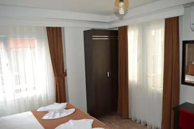 a hotel room with a bed with two towels on it at HOTEL GLOBAL 2022 in Istanbul