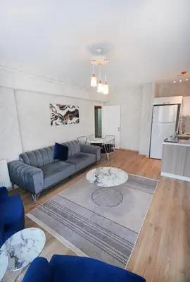a living room with a couch and a table at King Suite SS7 in Istanbul