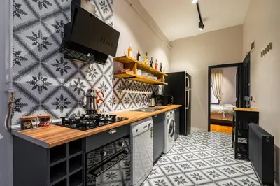 a kitchen with a stove and a counter top at Ganbaru Tours - Private Triplex&Duplex in Istanbul