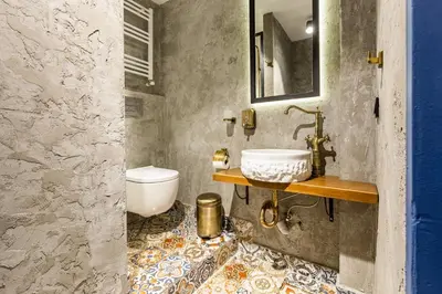 a bathroom with a sink and a toilet at Ganbaru Tours - Private Triplex&Duplex in Istanbul