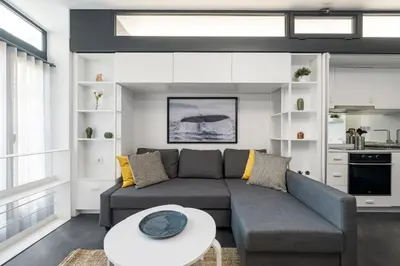 a living room with a couch and a table at Newly Designed Central Modern Smart Duplex! #143 in Istanbul