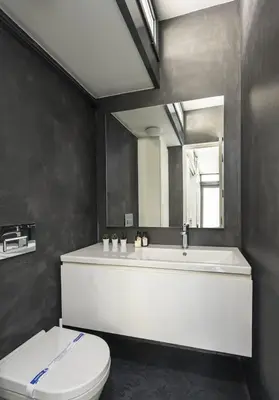a bathroom with a tub and a toilet and a mirror at Newly Designed Central Modern Smart Duplex! #143 in Istanbul