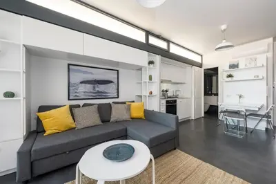 a living room with a couch and a table at Newly Designed Central Modern Smart Duplex! #143 in Istanbul