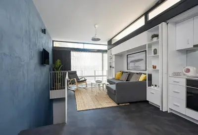 a living room with a couch and a table at Newly Designed Central Modern Smart Duplex! #143 in Istanbul
