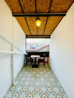 a small room with a table and bench in it at Puffin Boutique - Istanbul in Istanbul