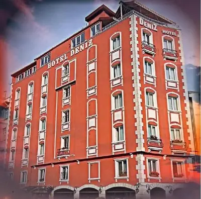 a large red building with the words hotel burns battery at deniz otel in Istanbul