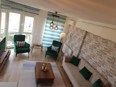a living room with a couch and two chairs at King Suite WH32 in Istanbul