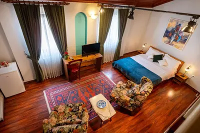 an overhead view of a bedroom with a bed and furniture at Nevalist Hotel in Istanbul