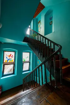 a staircase in a house with blue walls at Nevalist Hotel in Istanbul