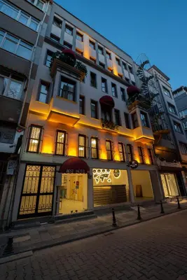 a lit up building on the side of a street at BEST HOTEL KADIKOY in Istanbul