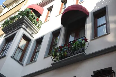 a building with windows with flower boxes on it at BEST HOTEL KADIKOY in Istanbul