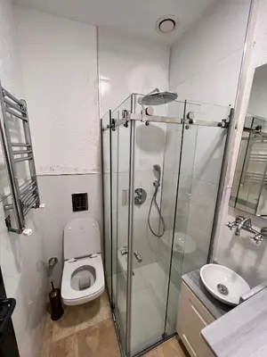 a bathroom with a shower and a toilet and a sink at AB Residences- Private Villa Independent in Istanbul
