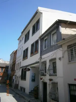 a white building with windows on a street at Nos Istanbul in Istanbul