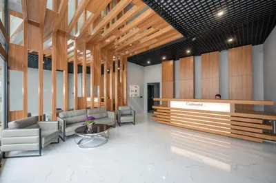 a lobby with couches and a table in a building at Continental Airport Hotel in Istanbul