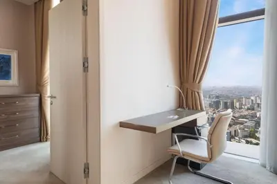 a room with a desk and a chair and a window at Istanbul Marriott Hotel Sisli in Istanbul