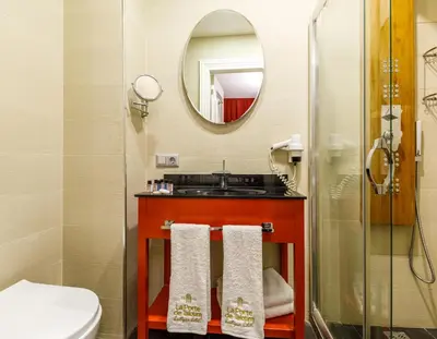 a bathroom with a sink and a mirror at La Porte de Taksim in Istanbul
