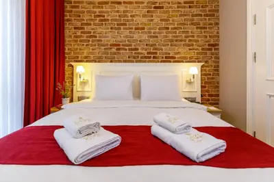 a bedroom with a large white bed with towels on it at La Porte de Taksim in Istanbul