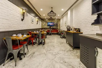 a restaurant with tables and chairs in a room at La Porte de Taksim in Istanbul