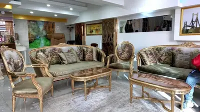 a living room with couches and tables and chairs at Metrolux Hotel in Istanbul