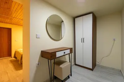 a bathroom with a vanity and a mirror on the wall at Candy Boutıque in Istanbul