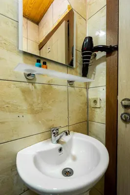 a bathroom with a sink and a mirror at Candy Boutıque in Istanbul