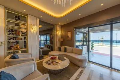 a living room with a couch and a table at MQ Hotel Suites & SPA in Arnavutköy