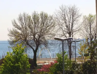 a street light and some trees and the water at Recital Park Hotel in Istanbul