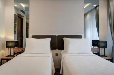 two beds sitting next to each other in a hotel room at Depiero Hotel Karaköy in Istanbul