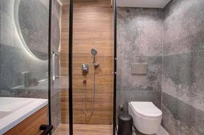 a bathroom with a shower and a toilet and a sink at Depiero Hotel Karaköy in Istanbul