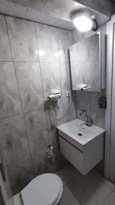 a bathroom with a toilet and a sink at Bona Sera Hotel in Istanbul