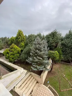 an overhead view of a park with a bench and trees at Silivri Gazitepe'de 3 katlı, havuzlu lüks villa in Silivri