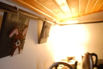 a room with a lamp and a picture on the wall at Duplex with terrace in center,5mn walk to Istiklal in Istanbul