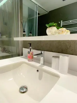 a white sink in a bathroom with a mirror at Luxury Central Fully Equipped 3BR 2BA Apartment by Siena Suites in Istanbul