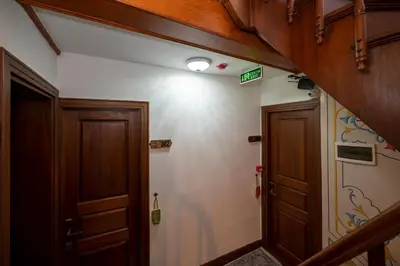 a hallway with two wooden doors and a light at Valeria Antique 1892 in Istanbul