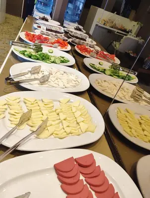 a long table with plates of food on it at HOTEL EURO DIAMOND in Istanbul
