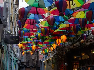 a bunch of colorful umbrellas hanging over a street at Genoa Port Hotel in Istanbul