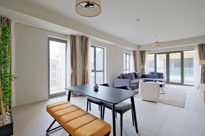 a living room with a table and a couch at New Inn Hotel Cadde 54 Mall in Sakarya
