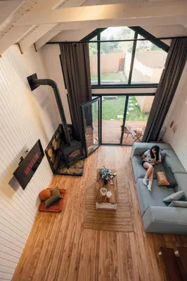 a woman sitting on a couch in a living room at Lemoon House Sapanca in Sapanca