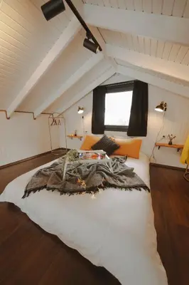a bedroom with a large bed in a attic at Lemoon House Sapanca in Sapanca