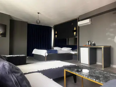 a bedroom with a bed and a living room at 216 Hill Suites in Istanbul