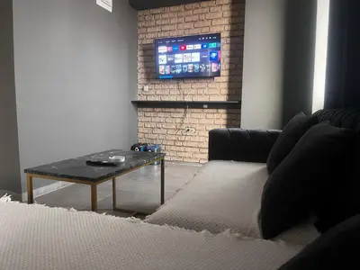 a living room with a couch and a table at 216 Hill Suites in Istanbul