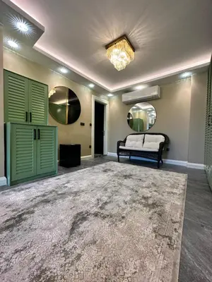 a large room with a bed and green doors at SAPANCA ALHARRAN VILLA in Sapanca