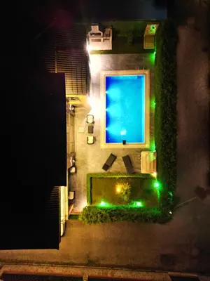 an overhead view of a swimming pool at night at SAPANCA ALHARRAN VILLA in Sapanca