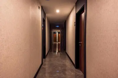 an empty hallway with a row of elevators in a building at Görükle Alpaş Yaşam Hotel in Bursa