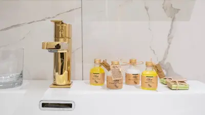a group of bottles of essential oils sitting on a counter at Loop Hotel Bosphorus İstanbul in Istanbul