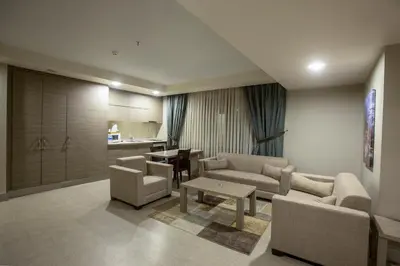 a living room with a couch and chairs and a table at Sen Otel in Sakarya
